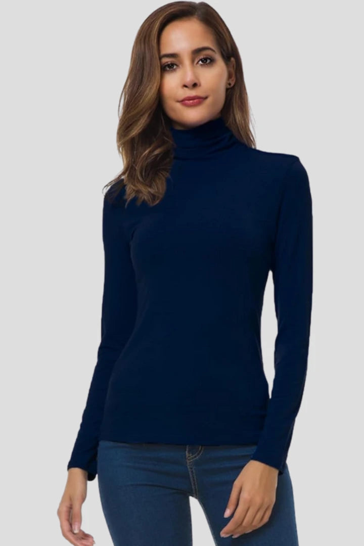 Woman wearing a navy turtleneck long sleeve plain sweater - studio photo