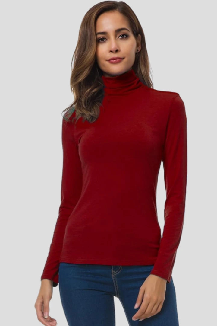 Woman wearing a red turtleneck long sleeve plain sweater - studio photo