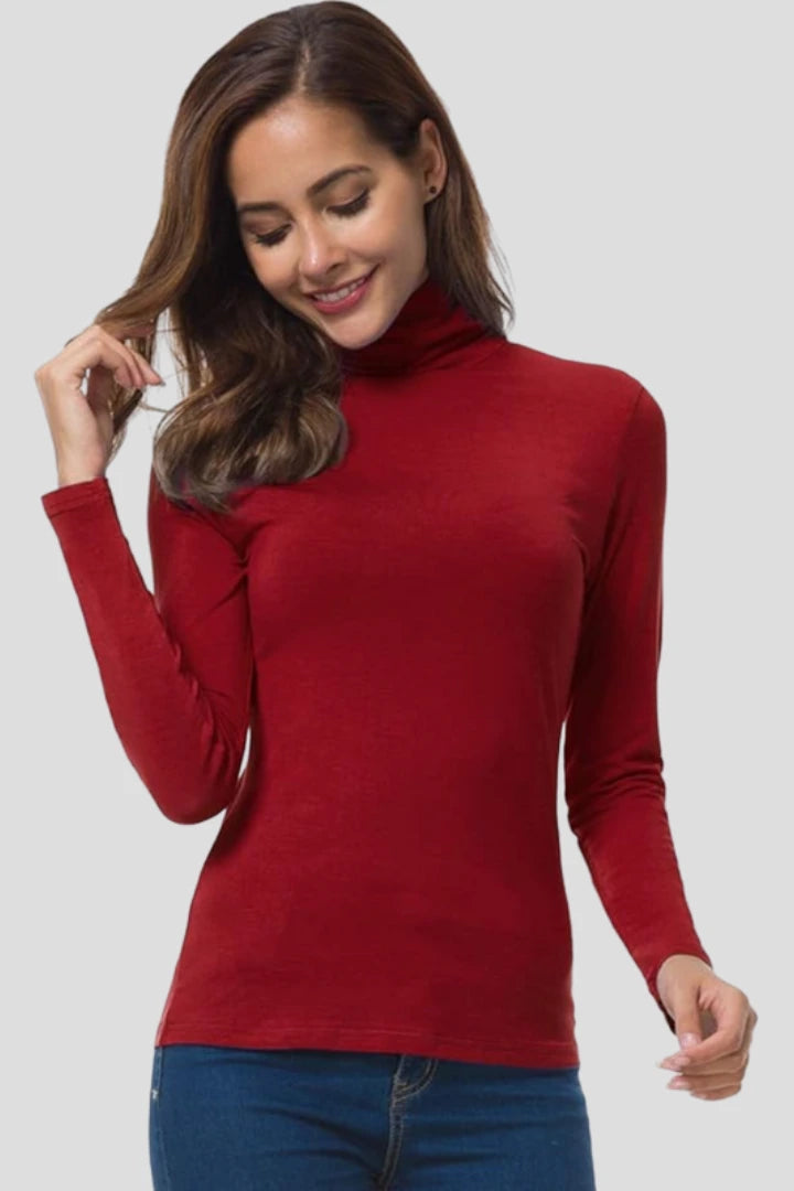 Woman wearing a red turtleneck long sleeve plain sweater - studio photo