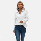 Woman wearing white zipper stand-collar ribbed knit sweater