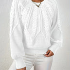 Woman wearing a white voluminous sleeve sweater with cable knit texture