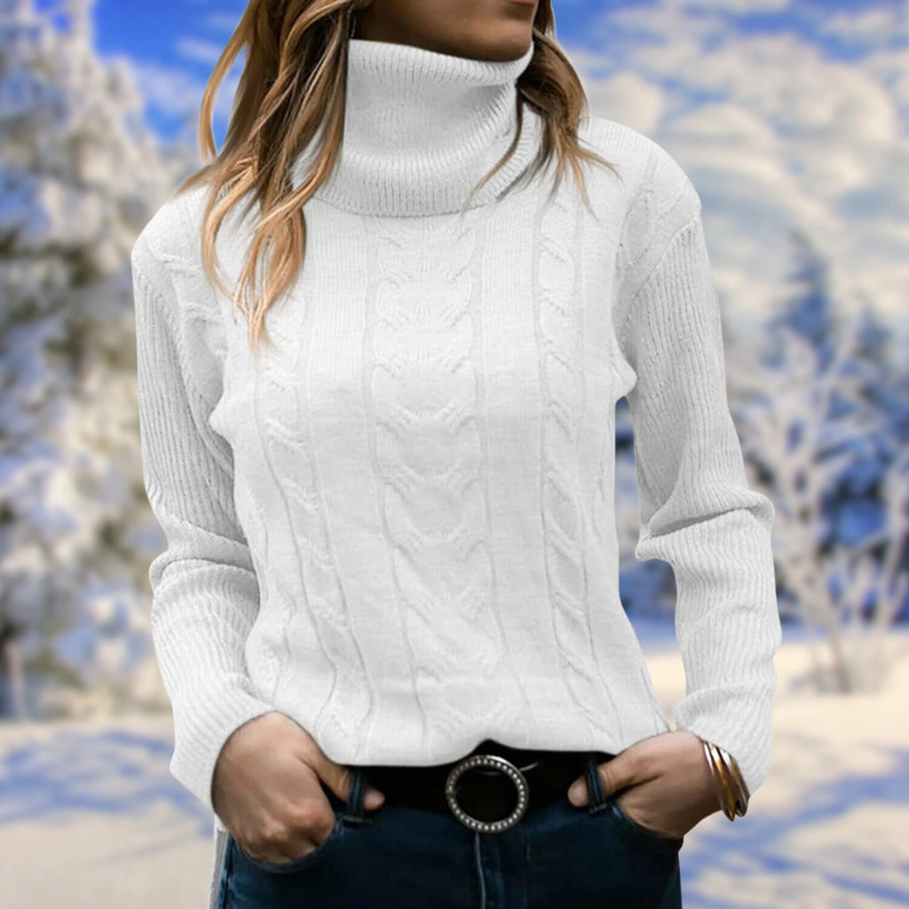 White cable-knit turtleneck sweater on model