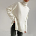 Driftly turtleneck sweater in white with relaxed fit and side split