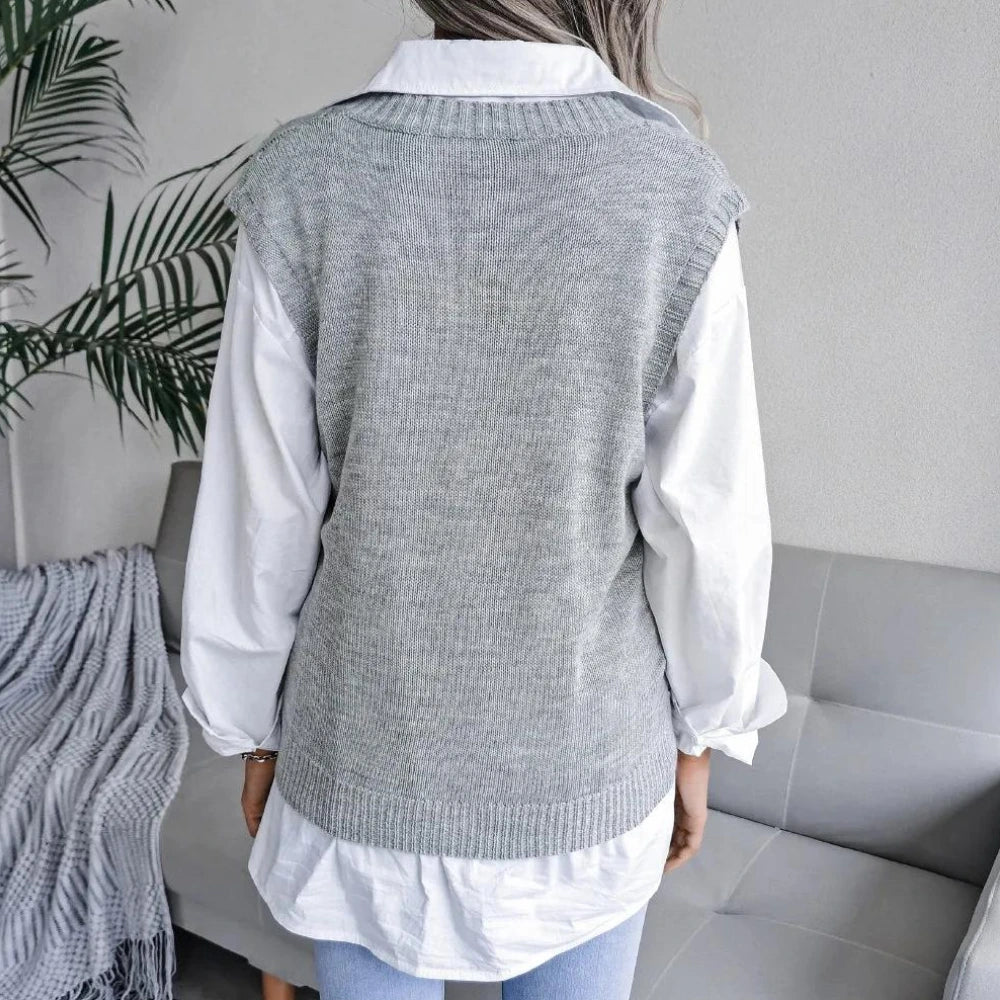 Back view of grey openwork sweater vest with relaxed fit