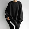 Black oversized crew neck sweatshirt with dropped shoulders, front view
