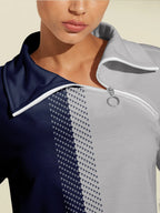 Quarter-zip collar detail on navy and grey golf sweatshirt