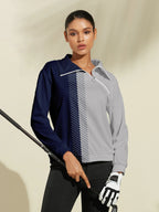 Model wearing navy and grey quarter-zip golf sweatshirt holding golf club