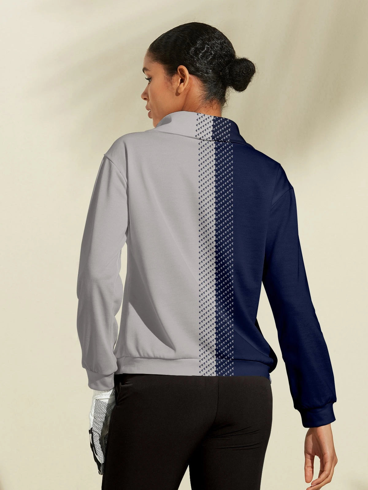 Navy and grey quarter-zip golf sweatshirt, side view