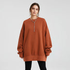 Orange oversized crew neck sweatshirt with dropped shoulders, front view