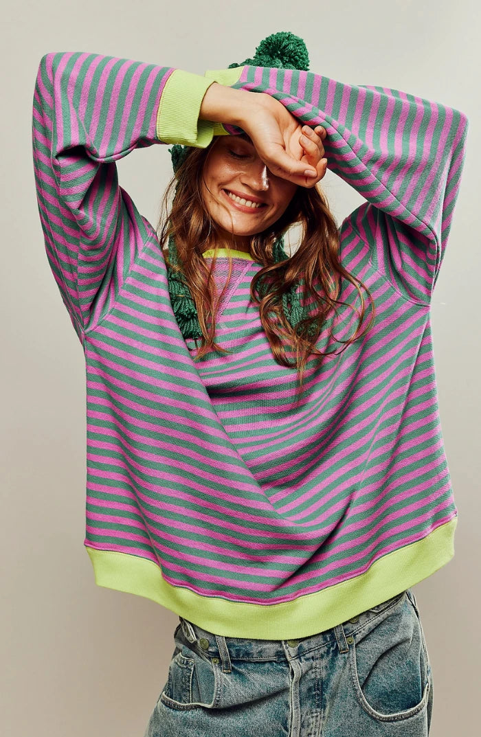Driftly oversized striped sweatshirt in pink and green, lifestyle view