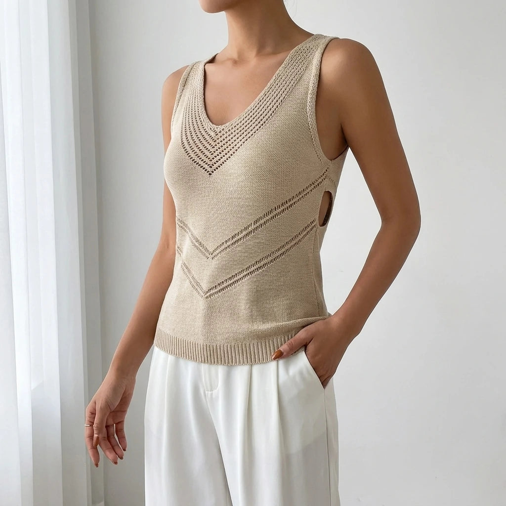 Driftly women's khaki sleeveless V-neck tank top, styled with white wide-leg trousers in a minimalist studio setting.