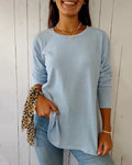 Blue long sleeve round neck ribbed knit top, front view