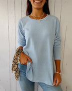 Blue long sleeve round neck ribbed knit top, front view