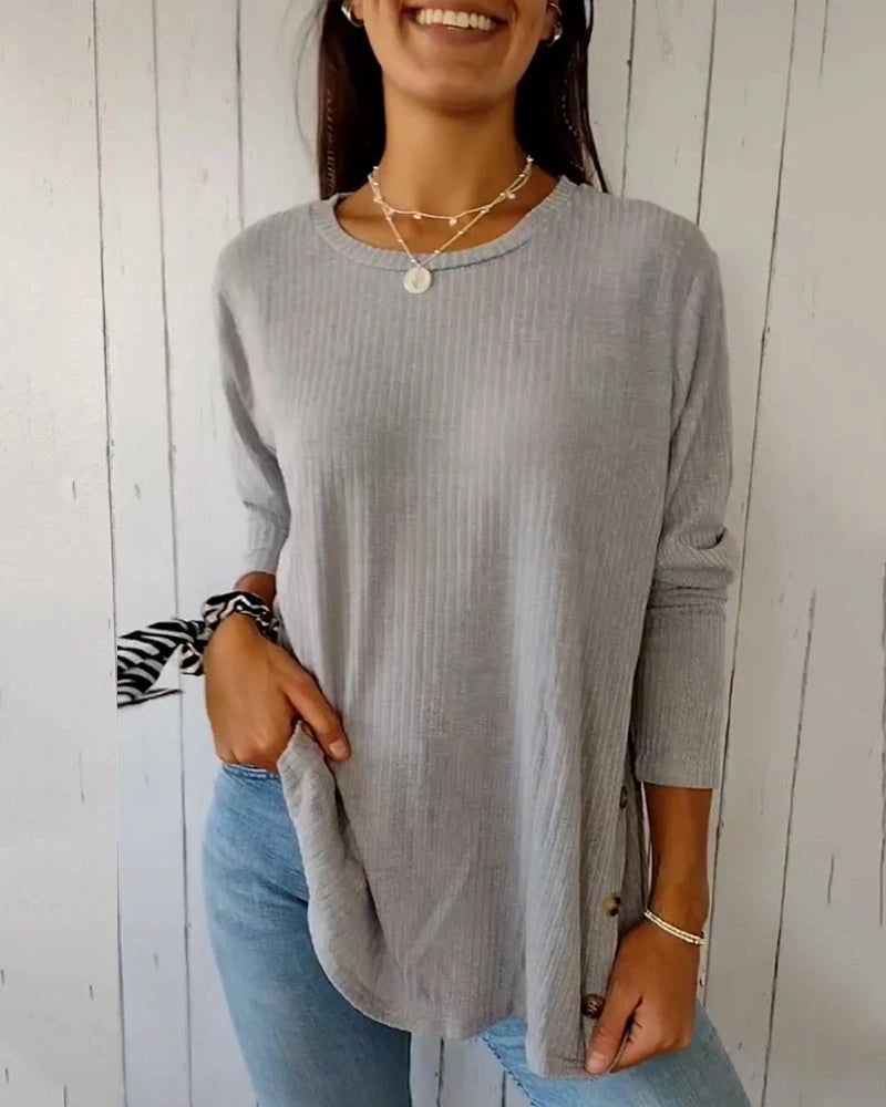 Grey long sleeve round neck ribbed knit top, front view