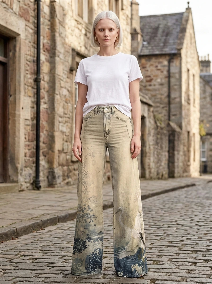 Woman in cream-beige tie-dye ombre wide-leg trousers standing on a cobblestone street