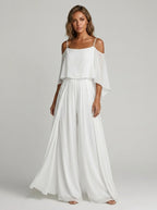 Woman wearing a white off-shoulder lightweight two-piece set in a studio setting