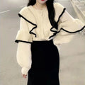 Cream ruffle-trim blouse and black fishtail skirt two-piece set, front view
