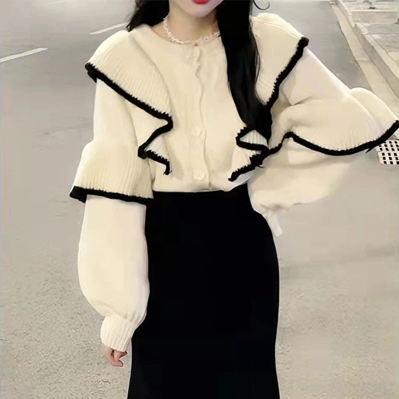 Cream ruffle-trim blouse and black fishtail skirt two-piece set, front view