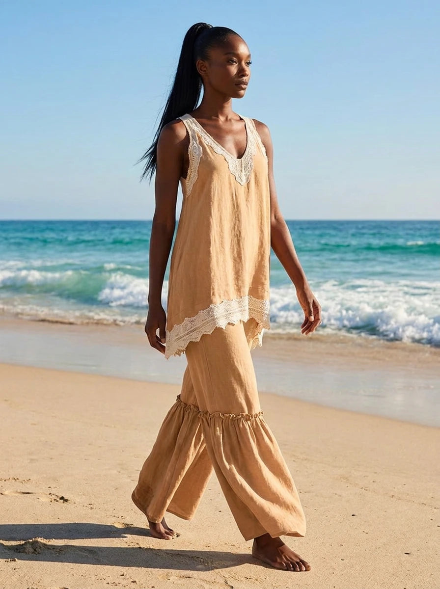 Woman wearing an apricot eyelash lace cami top and wide-leg pants two-piece set on a beach