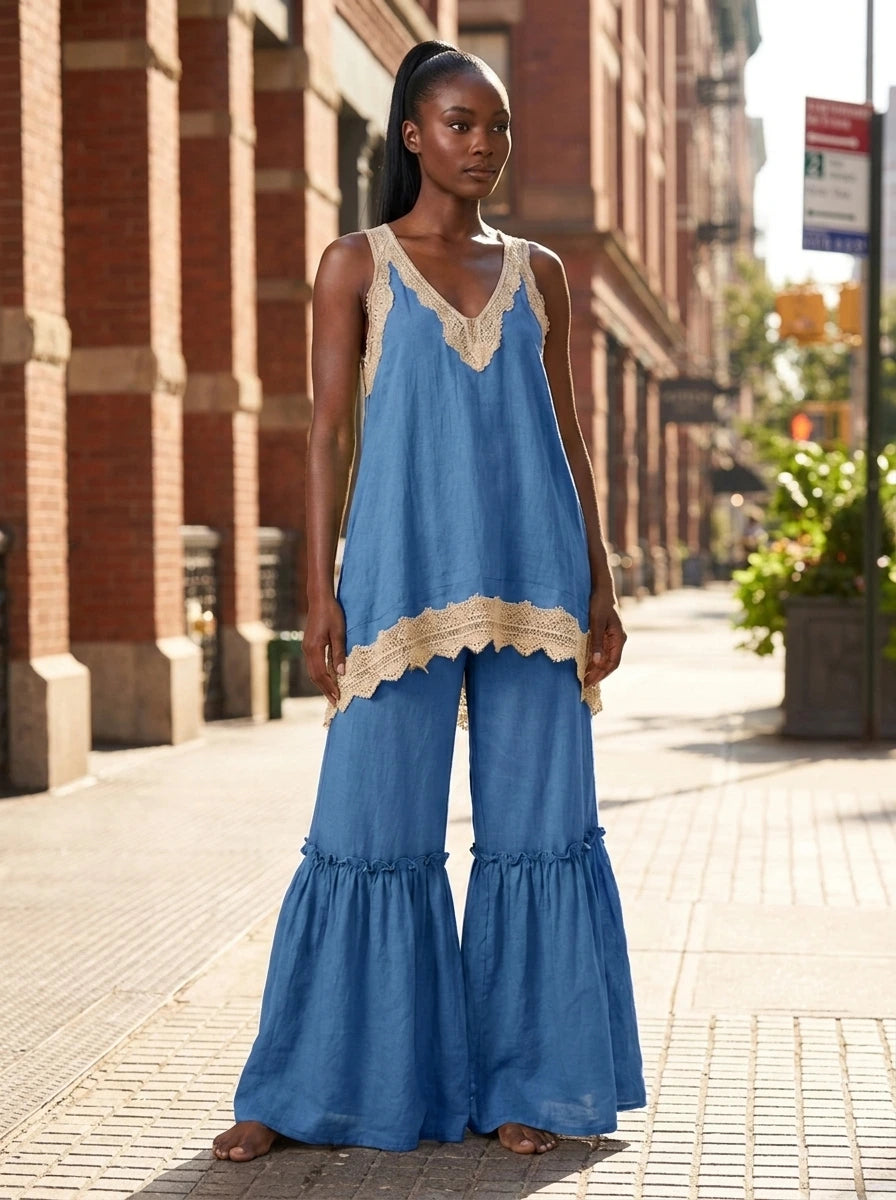 Woman wearing a blue eyelash lace cami top and wide-leg pants two-piece set on a city street