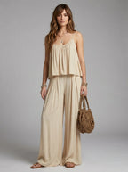 Woman wearing a khaki ruched cami and wide-leg drape two-piece set in a studio setting