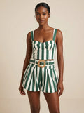 Woman wearing a green striped smocked tank top and bubble shorts two-piece set in a studio setting