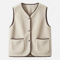 Beige plush sherpa vest flat lay studio shot