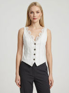 Woman wearing a white sleeveless vintage lace collar vest in a studio setting