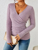 Driftly ribbed wrap top in purple with V-neck and side button detail, front view
