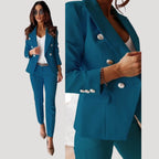 Woman wearing a blue double-breasted tailored blazer and trouser set