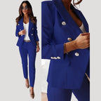 Woman wearing a navy blue double-breasted tailored blazer and trouser set