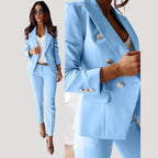 Woman wearing a light blue double-breasted tailored blazer and trouser set