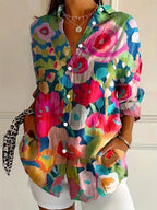 Woman wearing a mix colorful abstract floral print button-down blouse, back view in a studio setting