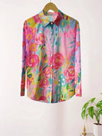 Full-length flat lay of a pink abstract floral print button-down blouse