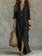 Woman wearing a black button-down maxi shirt dress with a wicker tote bag, studio setting