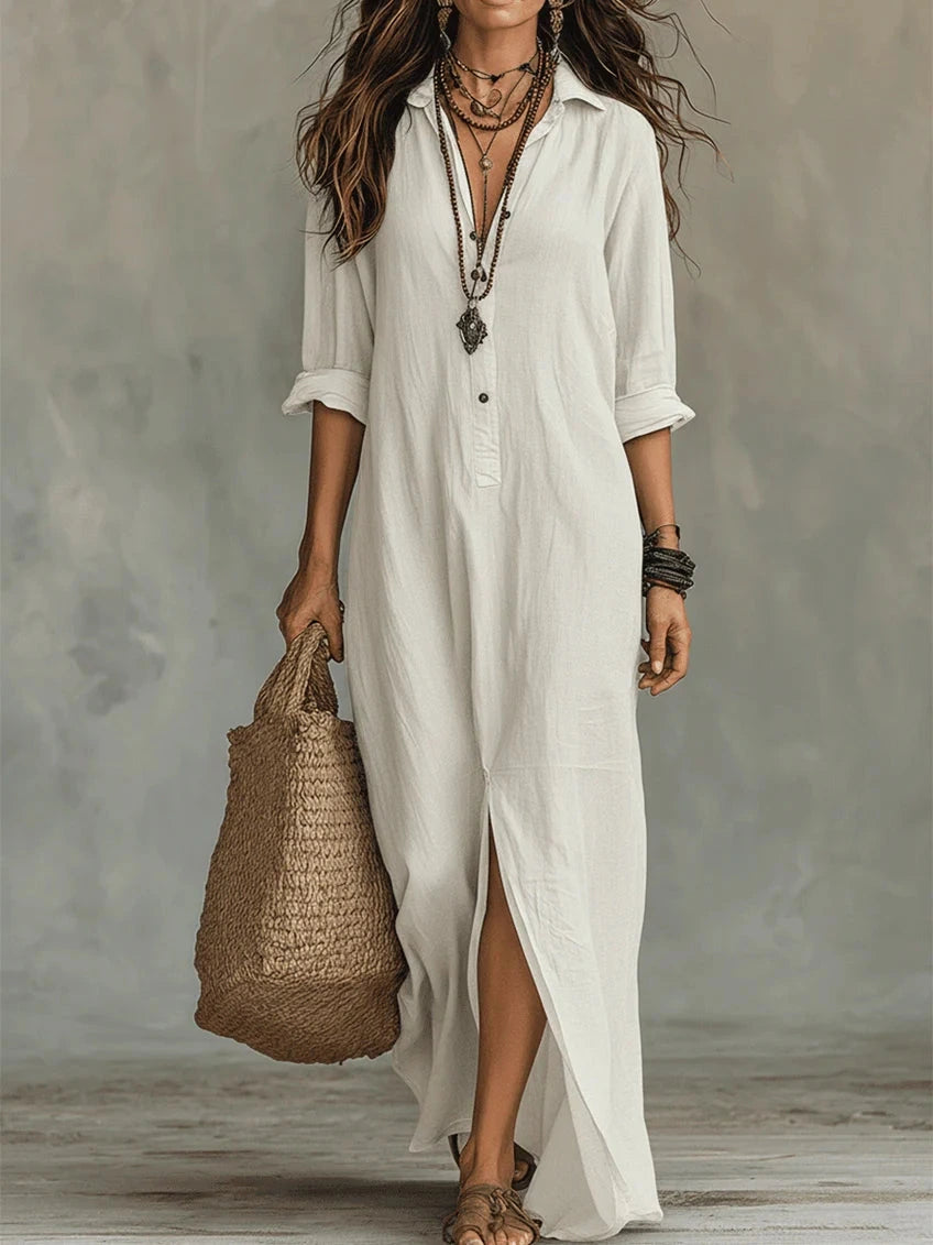 Woman wearing a white button-down maxi shirt dress with a wicker tote bag, studio setting