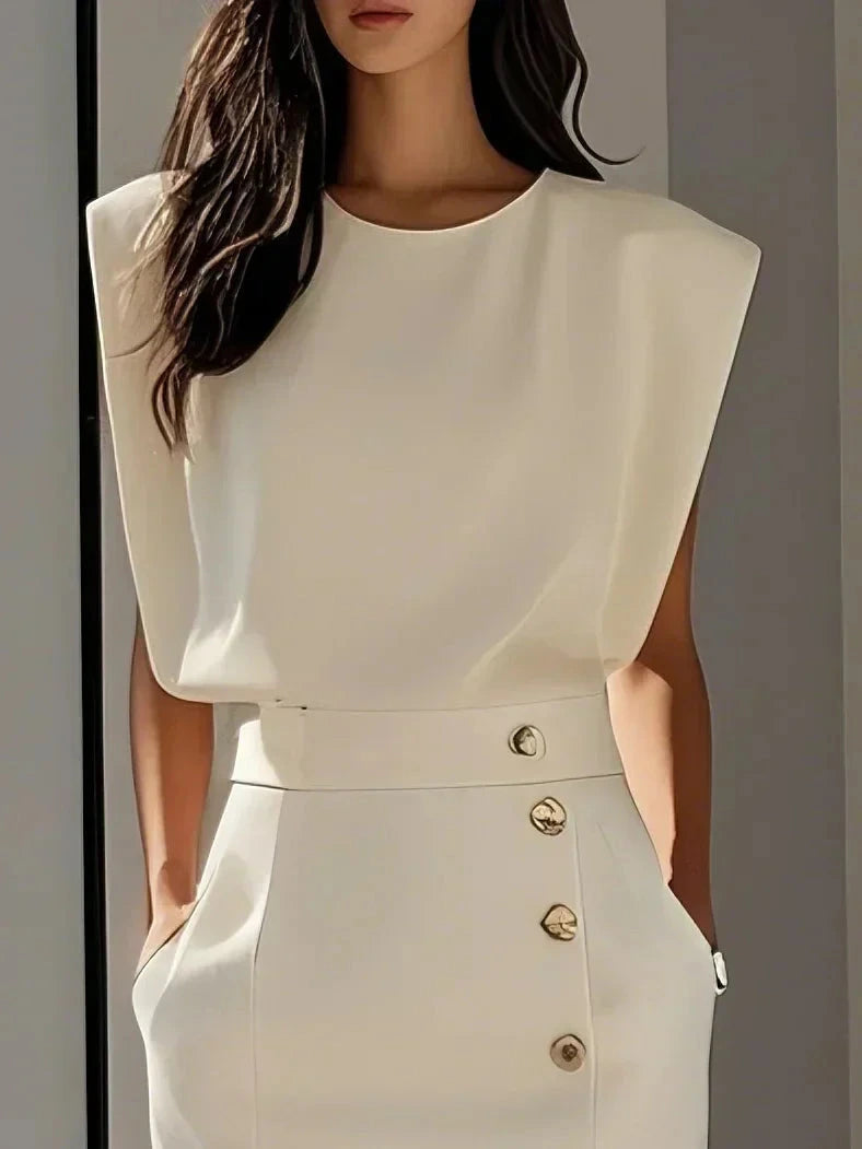 Woman wearing a beige button front sleeveless midi dress, close-up view