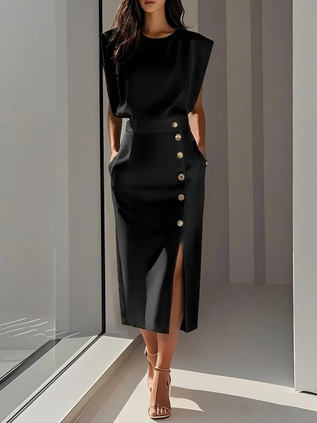 Woman wearing a black button front sleeveless midi dress in a studio setting