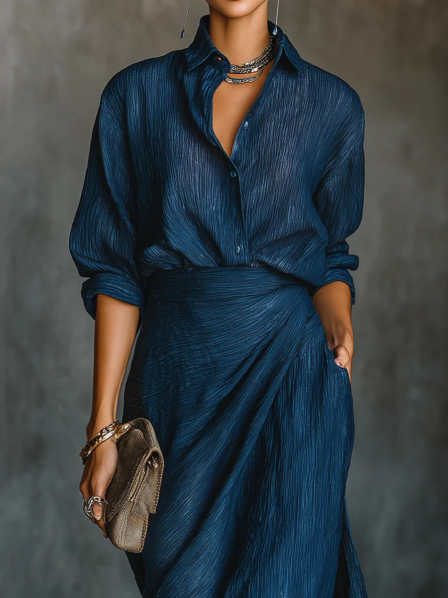 Woman wearing a dark blue elegant long-sleeve wrap maxi dress, close-up front view