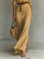 Close-up of a tan lapel collar belted maxi dress showing the belt and wrap skirt detail