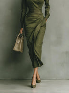 Woman wearing a military green maxi dress in a lifestyle setting