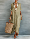 Woman wearing an olive green minimalist line maxi dress in a studio setting