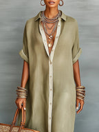 Woman wearing an olive green minimalist line maxi dress in a lifestyle setting