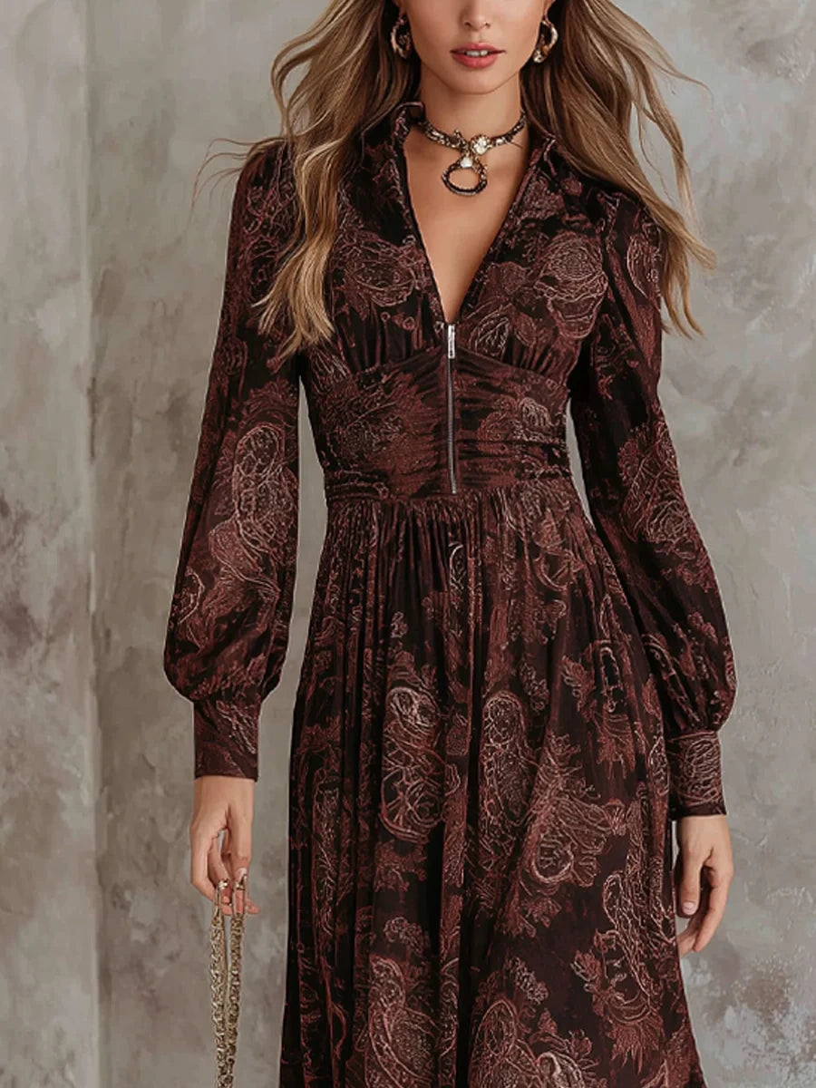 Woman wearing a brown paisley print long-sleeve fitted maxi dress, close-up front view