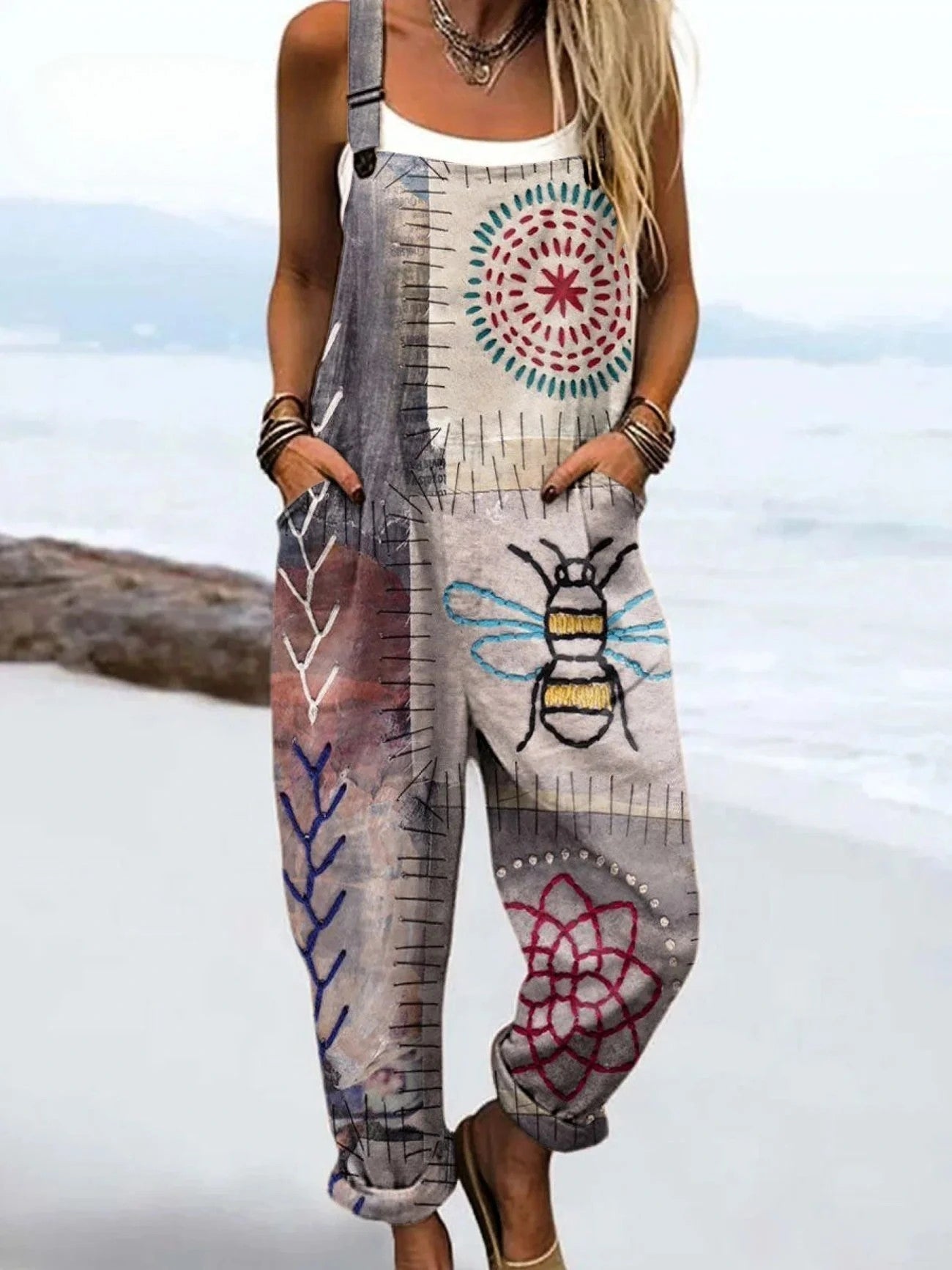 Woman wearing a bee print wide-leg jumpsuit, product catalog photo
