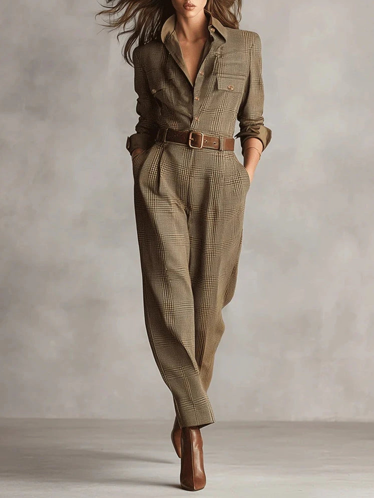 Woman wearing a brown checkered pattern jumpsuit with a belt, studio setting