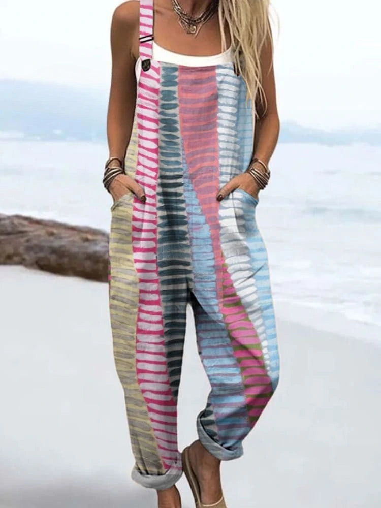 Woman wearing a coastal rhythm print jumpsuit, product catalog photo