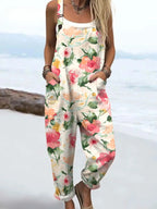 Woman wearing a white petal floral print jumpsuit, product catalog photo