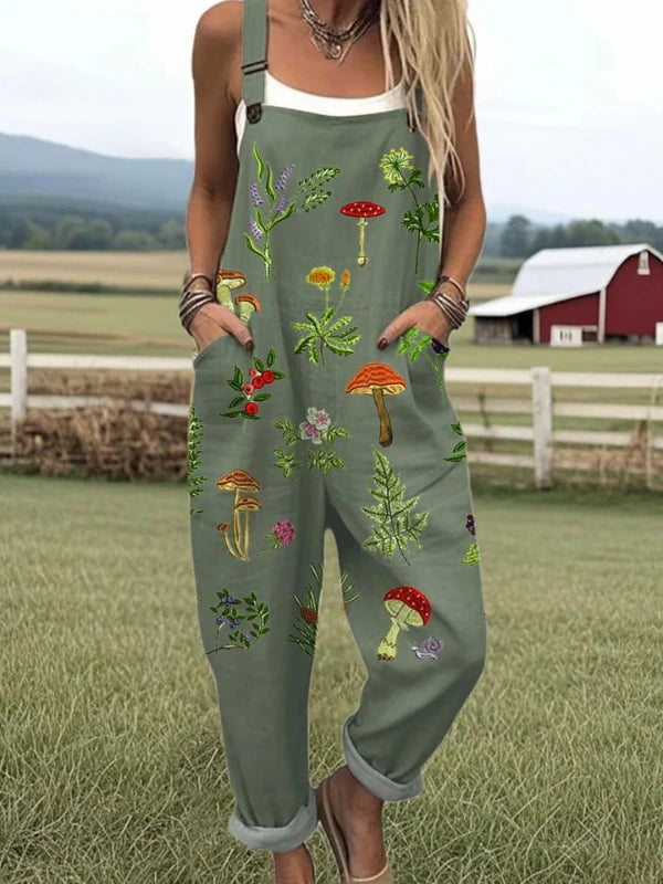 Woman wearing an olive green nature-inspired embroidery jumpsuit, product catalog photo