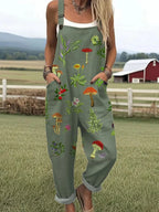 Woman wearing an olive green nature-inspired embroidery jumpsuit, product catalog photo